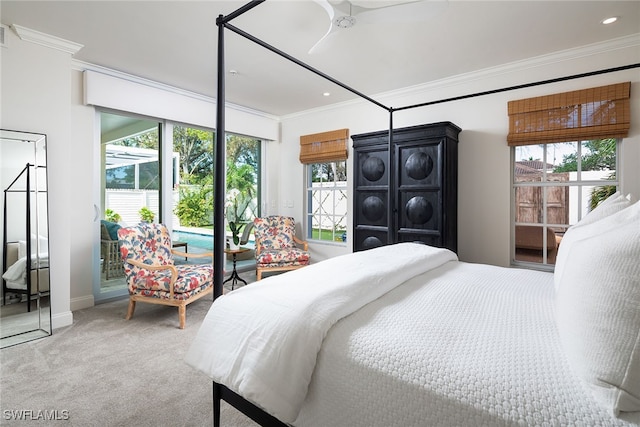 carpeted bedroom with crown molding and ceiling fan