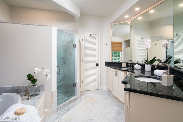 bathroom with independent shower and bath, vanity, and beam ceiling