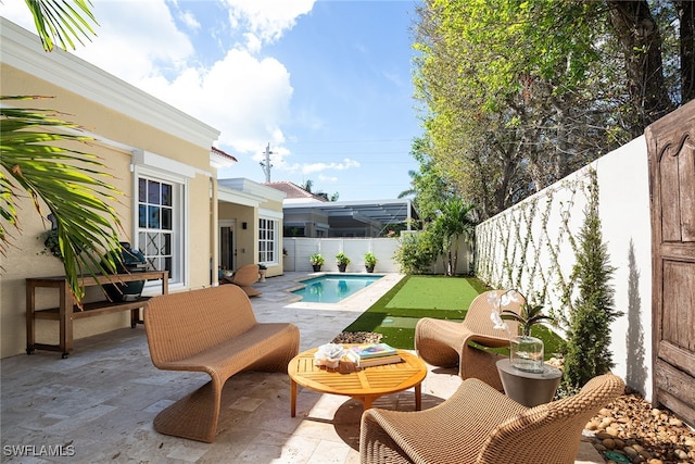 view of patio with an outdoor living space and a fenced in pool