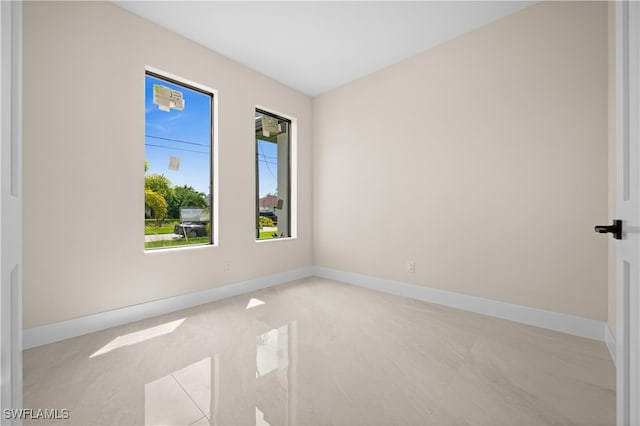 unfurnished room featuring light tile patterned floors