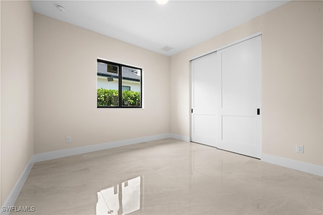 unfurnished bedroom featuring a closet