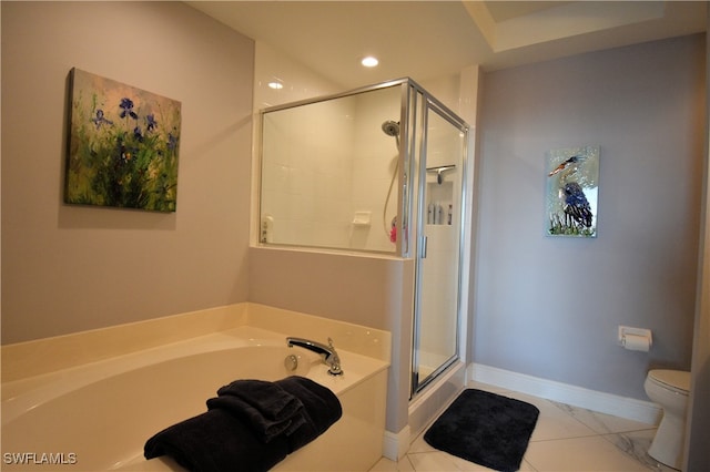 bathroom featuring separate shower and tub and toilet