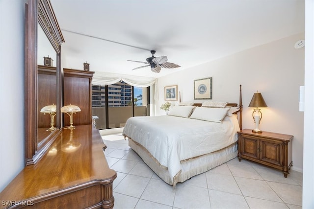 tiled bedroom featuring ceiling fan