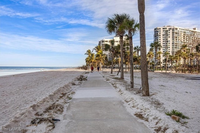 view of community with a water view and a view of the beach