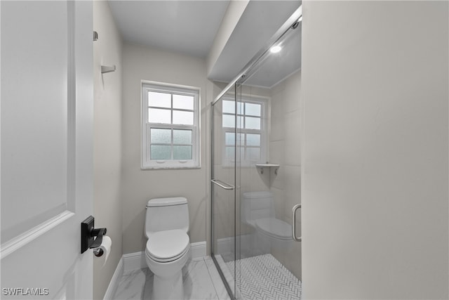 bathroom with toilet and walk in shower