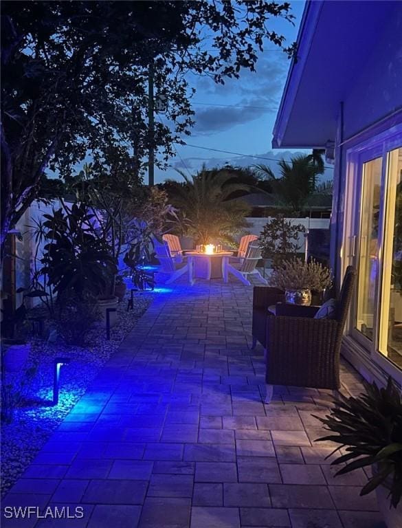 patio terrace at dusk with an outdoor fire pit