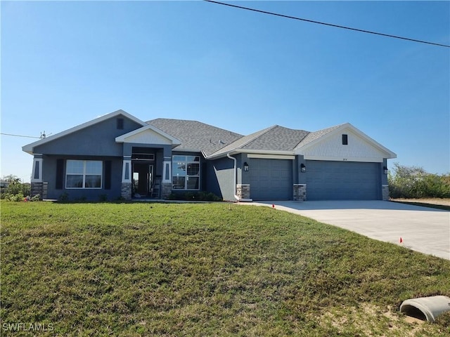 view of front of property with a garage and a front yard