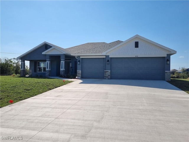 view of front of house with a garage and a front lawn