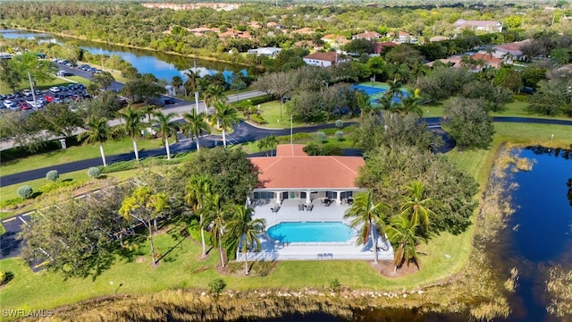 birds eye view of property with a water view