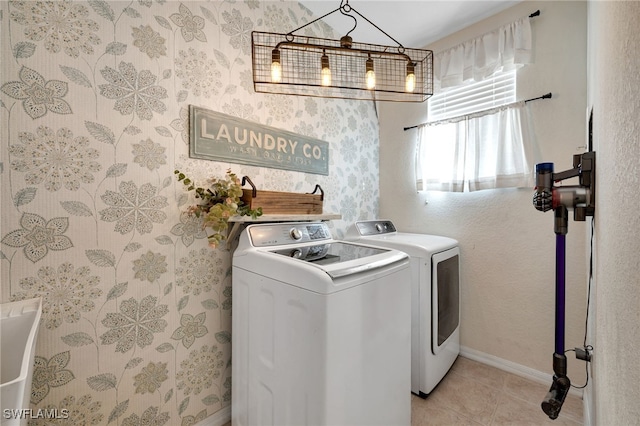 washroom featuring light tile patterned flooring and washer and clothes dryer