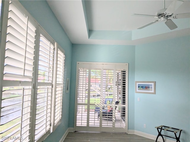 interior space featuring wood-type flooring and ceiling fan