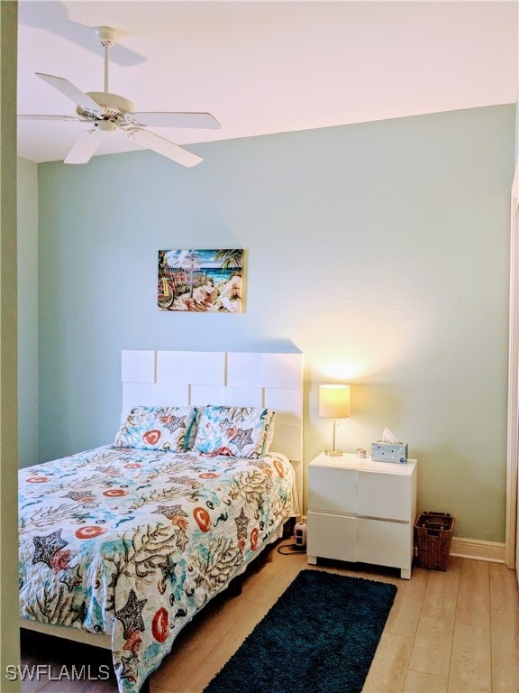 bedroom featuring wood-type flooring and ceiling fan