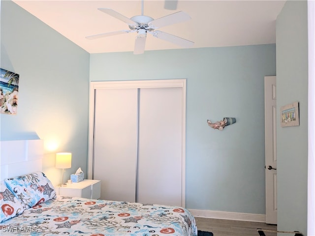 bedroom with a closet, ceiling fan, and wood-type flooring