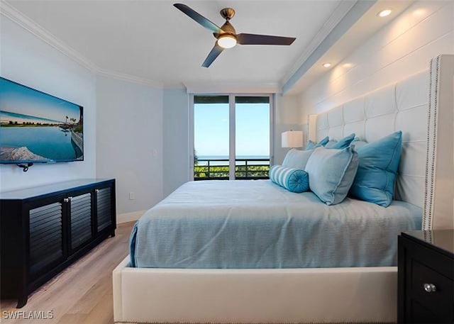 bedroom with floor to ceiling windows, access to outside, ceiling fan, light wood-type flooring, and ornamental molding