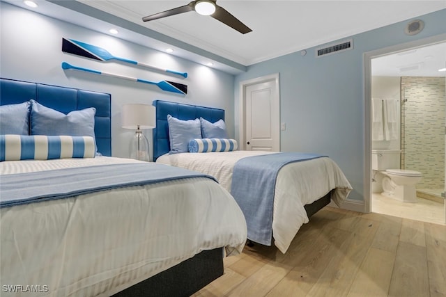 bedroom with connected bathroom, light hardwood / wood-style flooring, ceiling fan, and crown molding