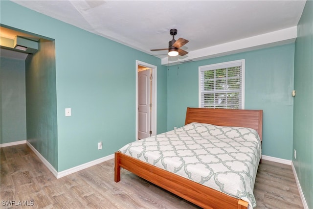 bedroom featuring wood-type flooring and ceiling fan