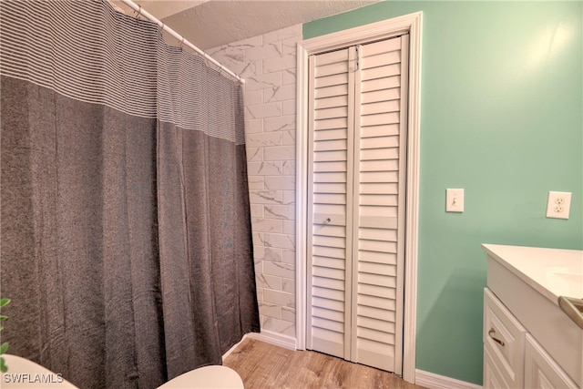 bathroom with vanity and hardwood / wood-style flooring