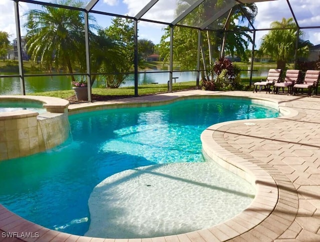 view of swimming pool featuring a lanai, a water view, an in ground hot tub, and a patio area