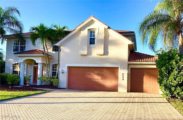 mediterranean / spanish-style house featuring a garage