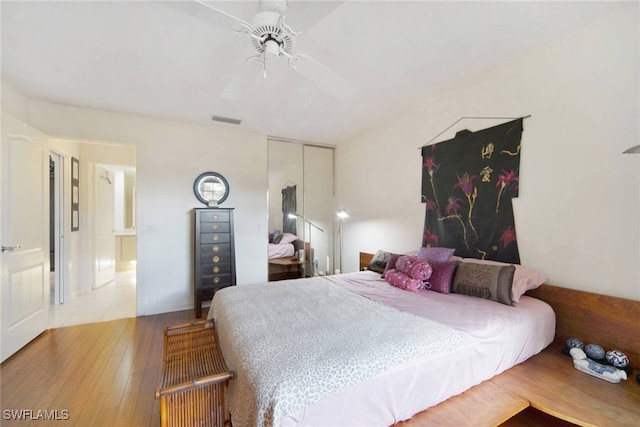 bedroom featuring light wood-type flooring and ceiling fan