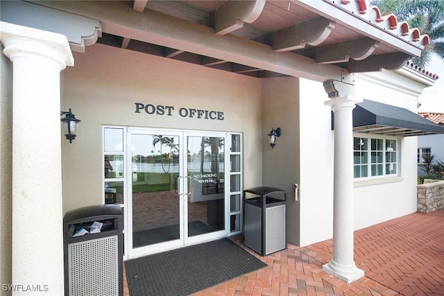 view of exterior entry featuring french doors