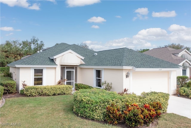 single story home with a front yard and a garage