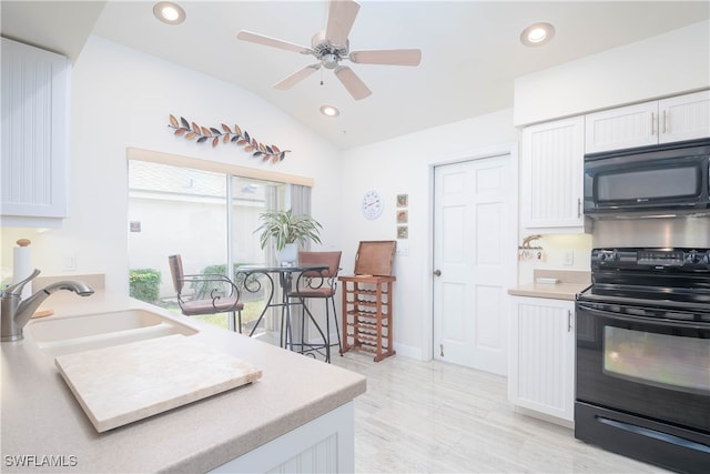 kitchen featuring vaulted ceiling, ceiling fan, sink, black appliances, and white cabinets