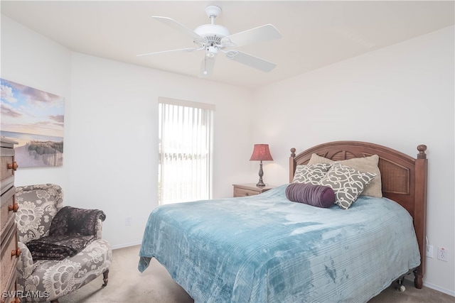 bedroom featuring ceiling fan and light colored carpet