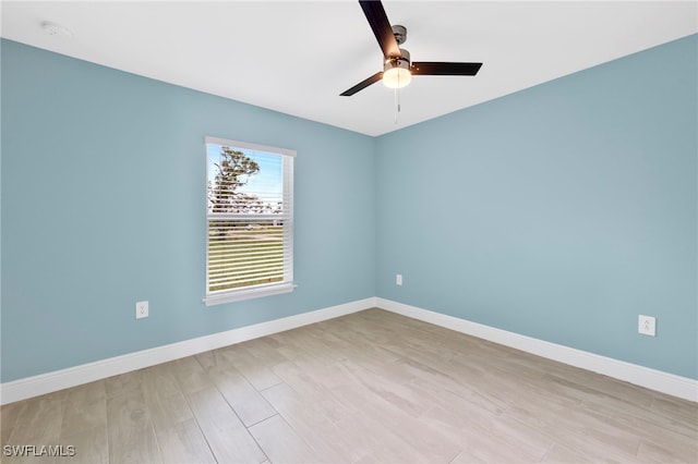 spare room with light hardwood / wood-style floors and ceiling fan