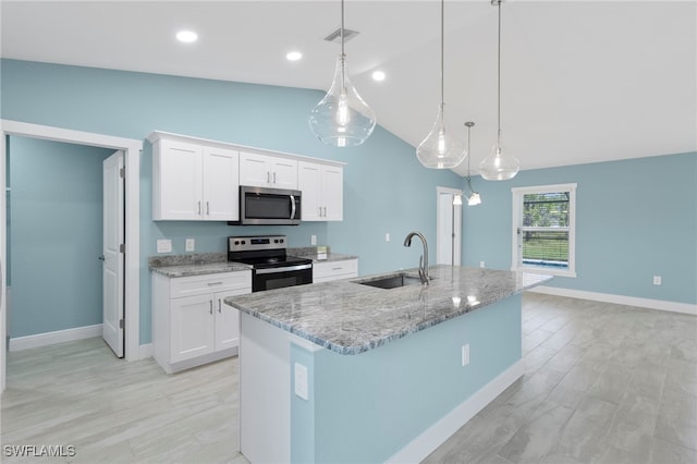 kitchen featuring white cabinets, hanging light fixtures, sink, vaulted ceiling, and appliances with stainless steel finishes