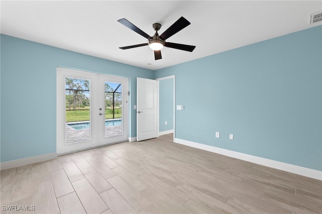 unfurnished room with french doors, light hardwood / wood-style floors, and ceiling fan