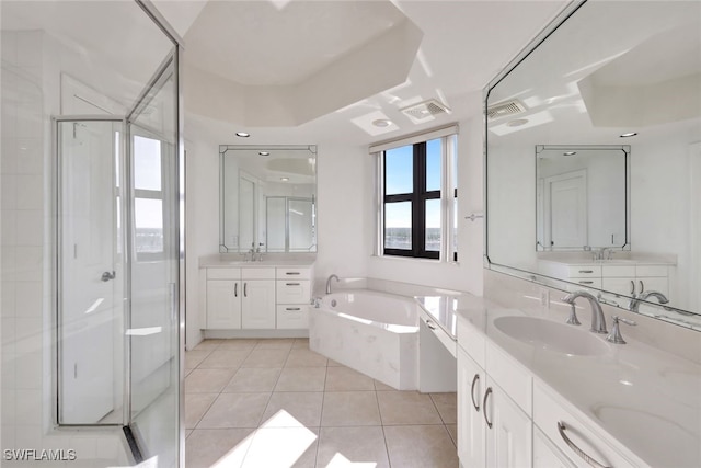 bathroom featuring shower with separate bathtub, tile patterned floors, and vanity