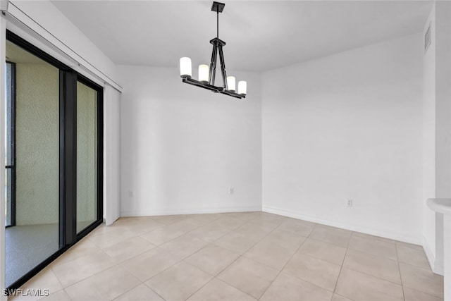 unfurnished dining area with a chandelier and light tile patterned flooring