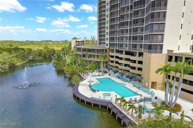 view of swimming pool with a water view