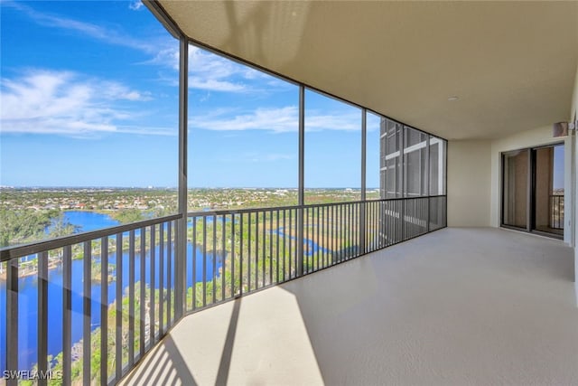 sunroom / solarium with a water view