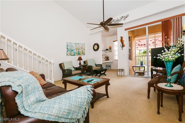 living room featuring carpet floors, high vaulted ceiling, and ceiling fan