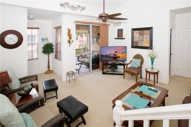 carpeted living room featuring ceiling fan and ornamental molding