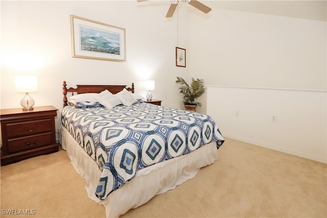 carpeted bedroom featuring ceiling fan and lofted ceiling