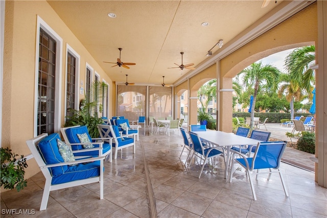 view of patio / terrace featuring ceiling fan