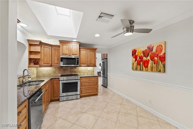 kitchen featuring open shelves, visible vents, ornamental molding, a sink, and appliances with stainless steel finishes