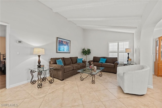 living room featuring lofted ceiling with beams, baseboards, and light tile patterned flooring