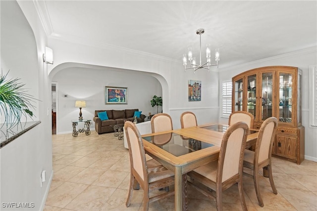 tiled dining space featuring a notable chandelier and crown molding