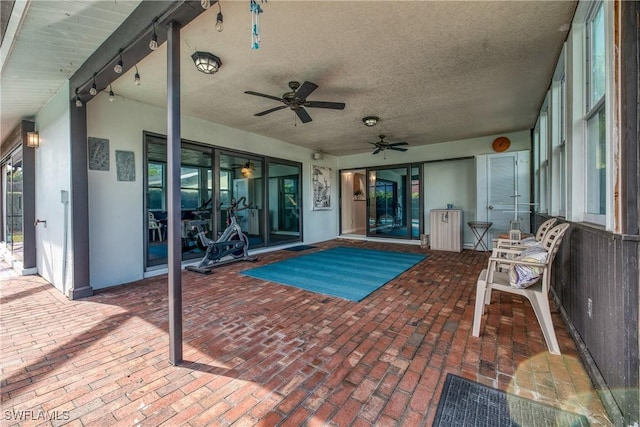 view of pool featuring ceiling fan and a patio