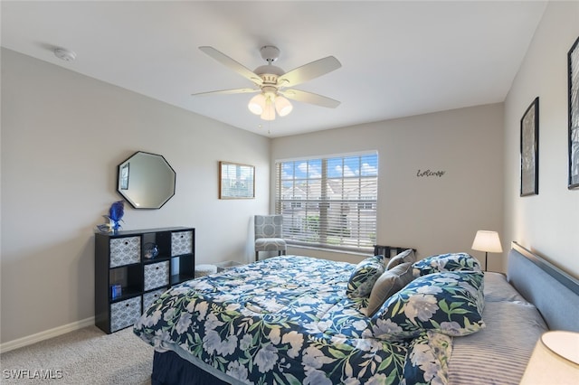 bedroom featuring ceiling fan and light carpet