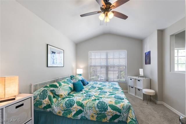 carpeted bedroom with ceiling fan, lofted ceiling, and multiple windows