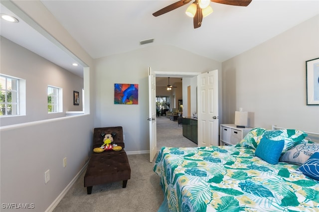 carpeted bedroom featuring ceiling fan and vaulted ceiling