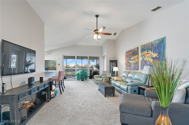 living room with carpet flooring, ceiling fan, and lofted ceiling