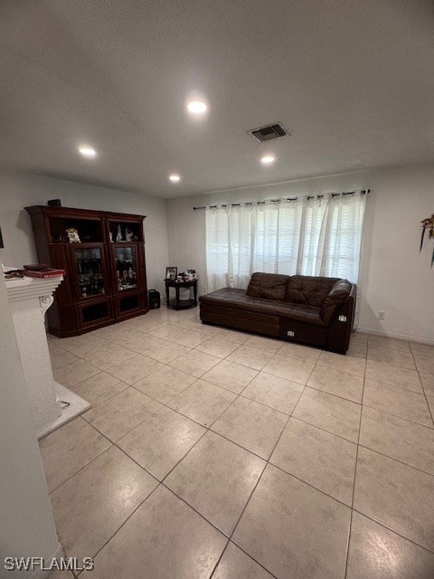 living room with light tile patterned flooring