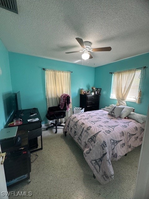 bedroom featuring a textured ceiling and ceiling fan