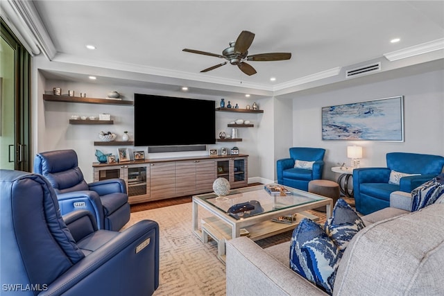 living room with ceiling fan and crown molding